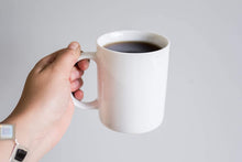 Load image into Gallery viewer, White coffee mug with coffee inside, buy custom photo mugs canada and USA.