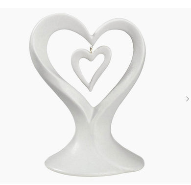 Wedding cake topper featuring white dangling double hearts | Elegant cake decoration | Heart-themed cake embellishment | Romantic wedding accent | Delicate double heart cake adornment