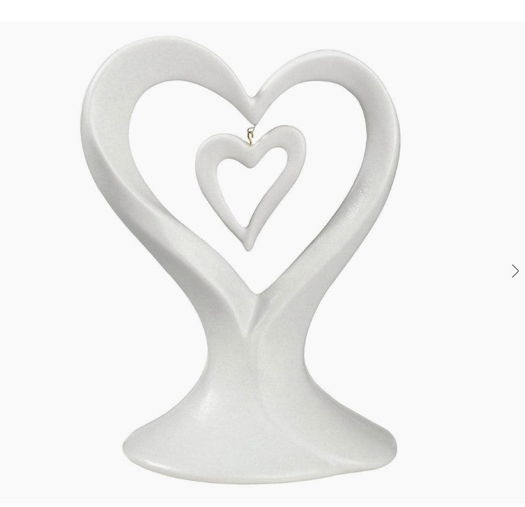 Wedding cake topper featuring white dangling double hearts | Elegant cake decoration | Heart-themed cake embellishment | Romantic wedding accent | Delicate double heart cake adornment
